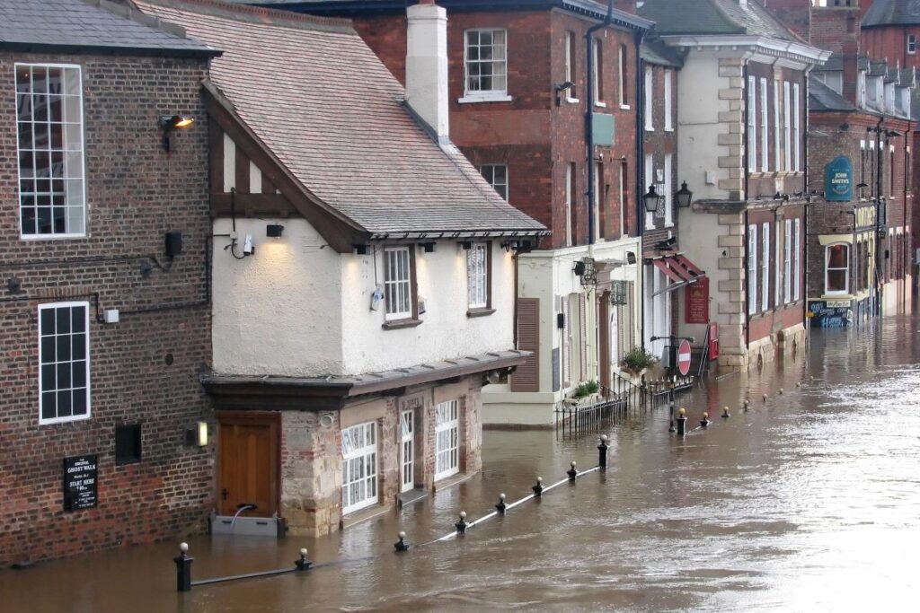 Flooded street with houses submerged under water